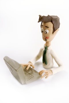 Plasticine handmade businessman with laptop