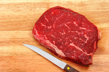 raw steak on cutting board