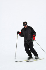 man skiing fast