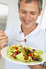 Middle Aged Man Eating A Healthy Salad