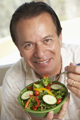 Middle Aged Man Eating Salad