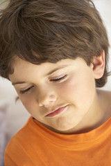 Portrait Of Young Boy Sulking