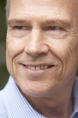 Portrait Of Middle Aged Man Smiling Happily