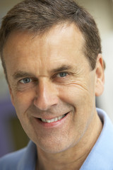 Portrait Of Middle Aged Man Smiling At The Camera
