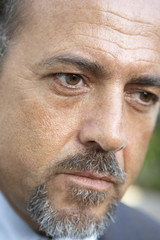 Portait Of Middle Aged Man Looking Serious