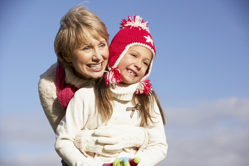 Obraz premium Grandmother Hugging Her Granddaughter