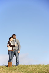 Couple Standing In The Park