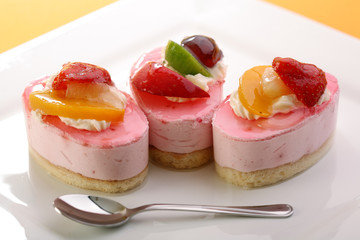 cheesecake with fresh fruits and spoon