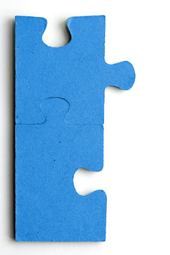 Two blue jig saw pieces connected