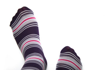 beautiful legs in funny socks over white