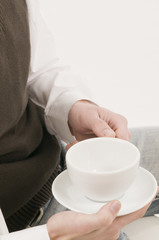 anonymous man hold the cup
