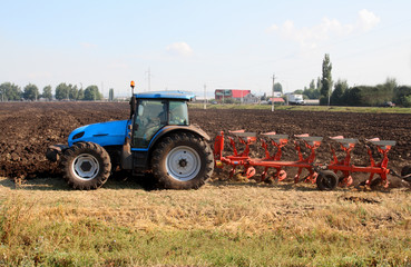 Fototapeta premium tractor with plough
