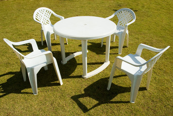 Four plastic chairs