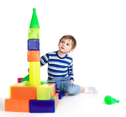 Child plays with color blocks