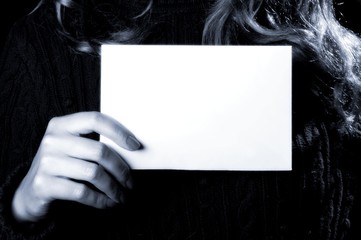 Woman holding a piece of paper