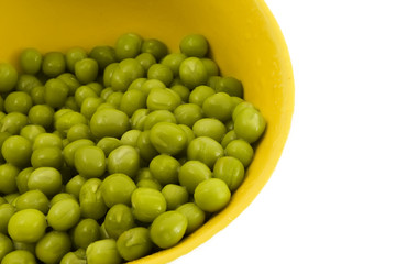 Green pea in a yellow dish is isolated