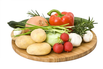 vegetables arranged on a wooden board