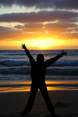 Fototapeta premium Person arms stretched with sunset