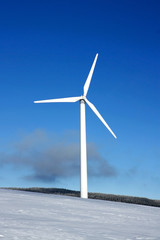 white wind turbine on snow