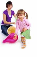 Mother and his  daughter with colorful balloons.