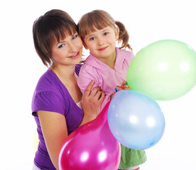 Fototapeta na wymiar Mother and his daughter with colorful balloons.