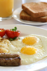 Fototapeta premium Breakfast - Eggs, Potatoes and Sausage