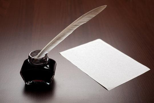 Quill, ink and paper