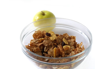 Delicious muesli in a glanse dish with apple isolated