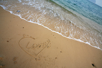 love on beach with wave