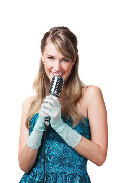 Pretty young girl singing into retro microphone