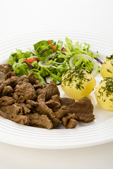 Grilled meat with boiled potatoes, sauce and vegetable salad