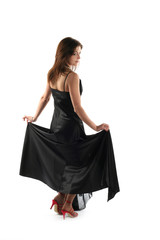 Girl in black dress isolated on white background