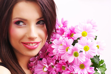 Attractive young woman face with flowers