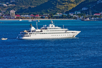 Fototapeta na wymiar Massive White Yacht in Blue Bay
