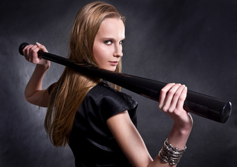 Fototapeta na wymiar fashion girl with the baseball bat