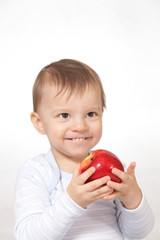 laughing baby with red apple