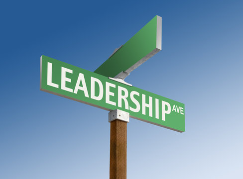 Green street sign with "Leadership" printed on it