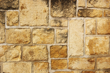 Fragment of rough old brick wall