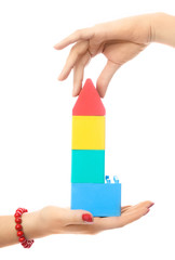 two people making a toy house