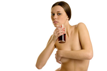 naked woman with glass of juice