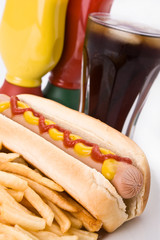 Fast food meal with hotdog, French fries and a cola.