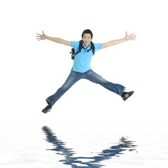 Reflection for excited young man jumping in mid-air cheering
