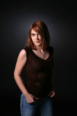 pretty red headed teenage girl in dark shirt