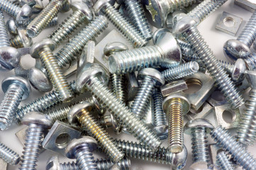 Assortment of various sized nuts and bolts.