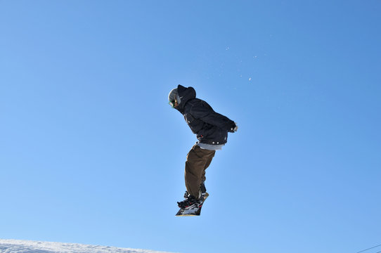 girl snowboarder in the air