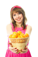 girl giving us a basket full of tangerines