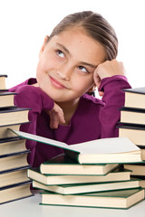 Adorable girl with many books thinking