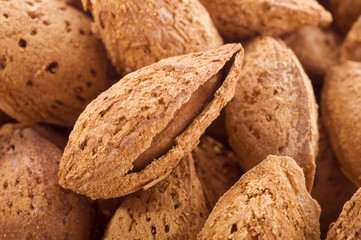 Close up for pile of almond nuts as whole background