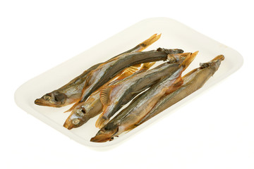 Dried capelin in the plastic container