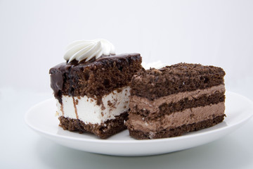 Two chocolate cakes on white background